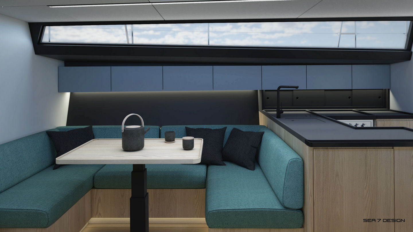 Sea 7 Design, yacht 50 ft interior design, the view of the mess. U-shape turquoise sofa. A dining table with a kettle and cups. Middle gray hanging cabinets on the black wall.